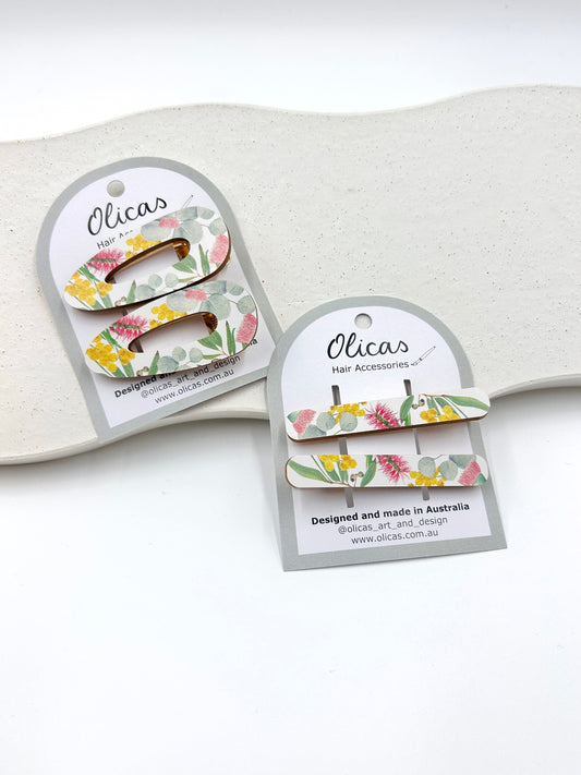 Floral hair accessories with packaging on a white background